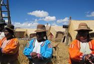 Isla Uros, Lake Titicaca, Peru (2009) | Housewives on Isla Uros singing a song to farewell us.